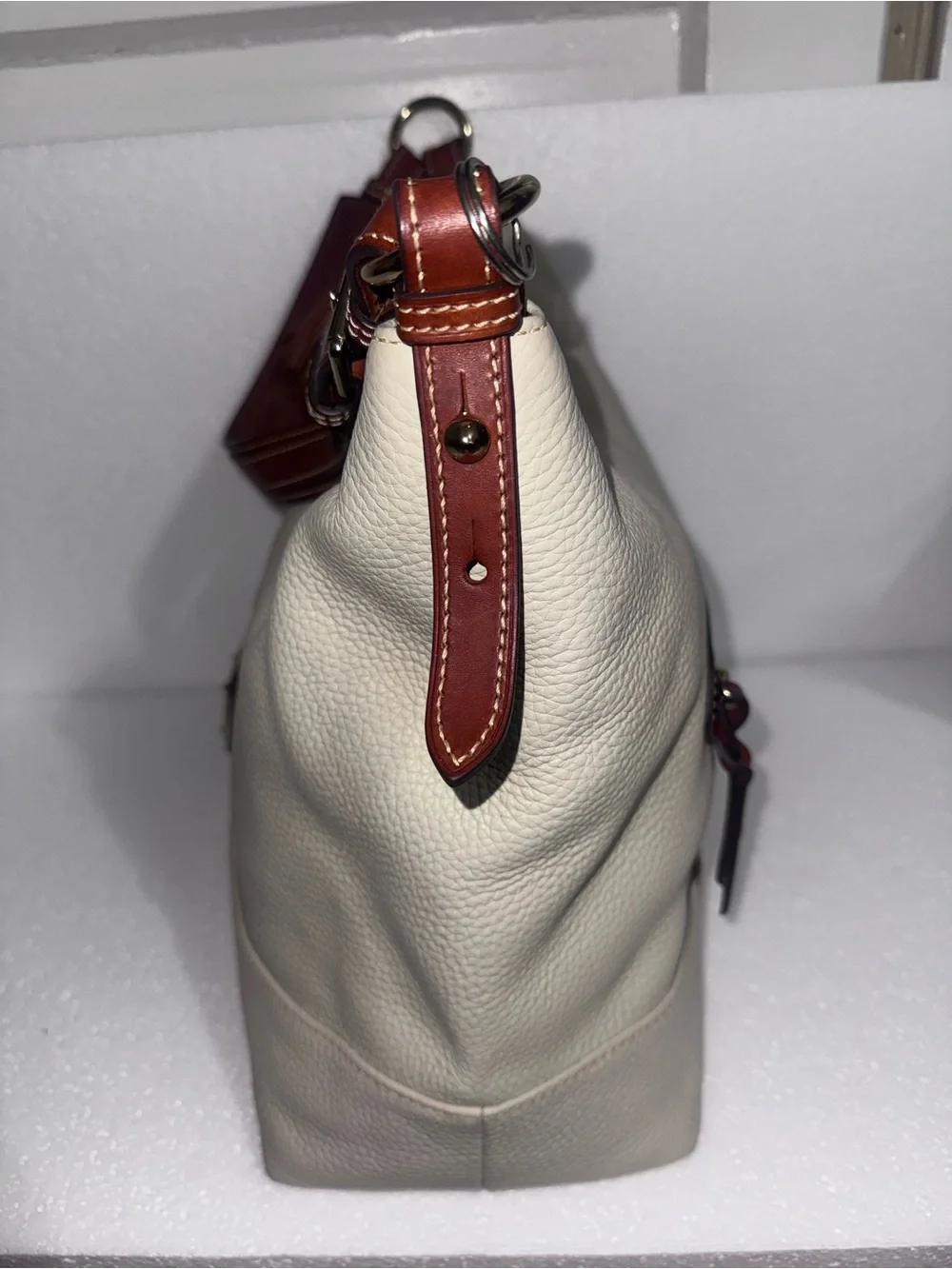 Dooney & Bourke Cream Leather Hobo with Brown Trim and Tassel